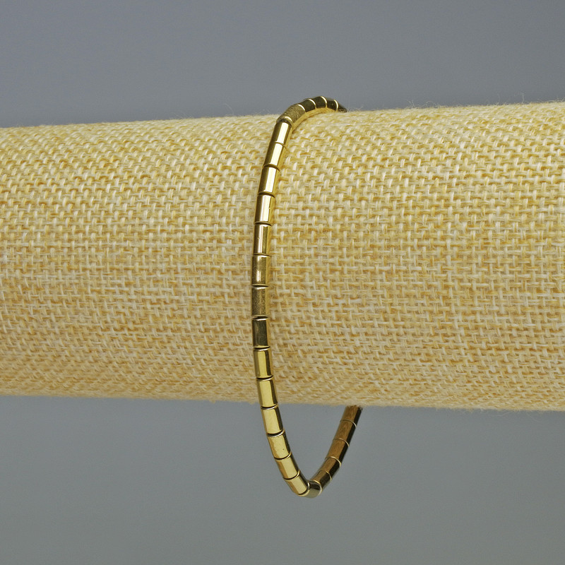 Náramek z hematitu, válcové korálky, zlatá barva, průměr 5×3 mm, délka 18 cm, elastický