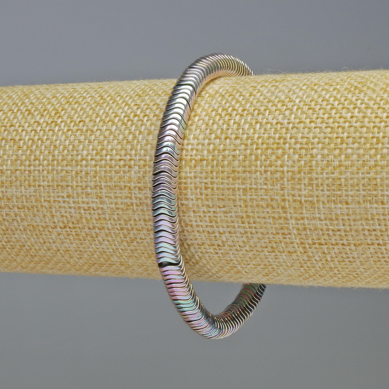 Náramek z hematitu, rondely ve tvaru vlny, duhově stříbrná barva, průměr 6×1 mm, délka 18 cm, pružný