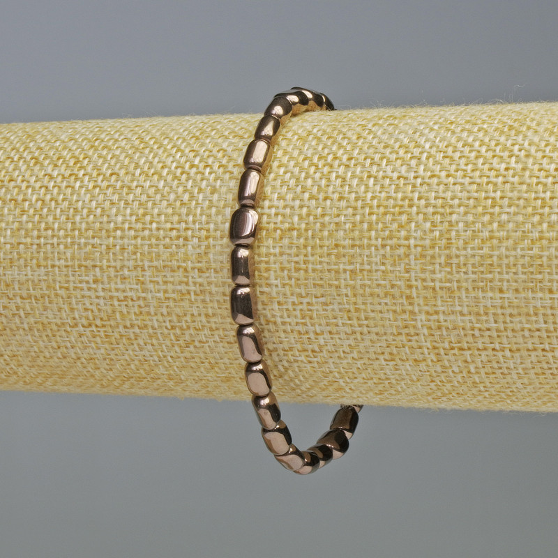 Náramek z hematitu, oválný tvar, bronzová barva, průměr 7×5 mm, délka 18 cm, elastický