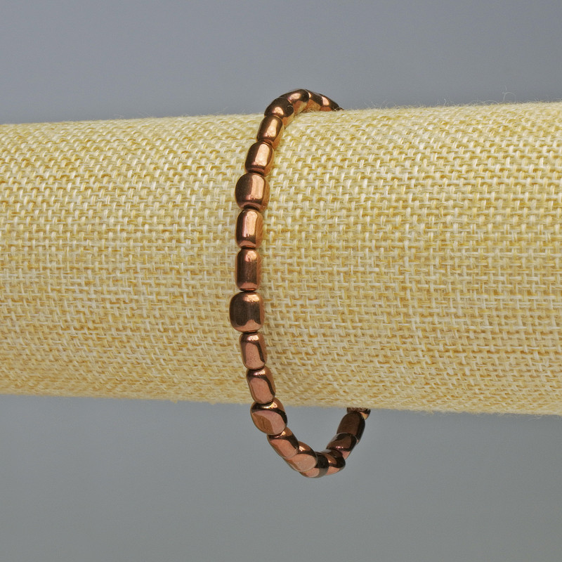 Náramek z hematitu měděné barvy, oválné korálky 7×6 mm, délka 18 cm, elastický