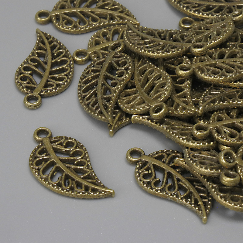 Přívěšek List bronzové barvy, průměr 18×10 mm ± otvor 1,5 mm ± balení 27 ks