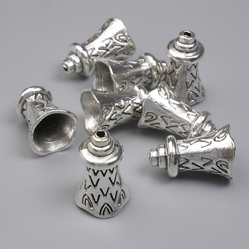 Koncovka na korálek, barva kovu: stříbrná, průměr 17×11 mm ± otvor 1 mm ± balení 20 g (~8 ks)