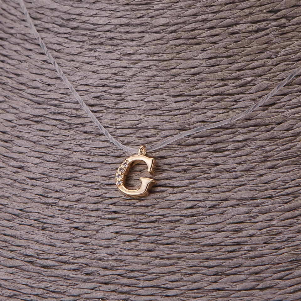 Přívěšek, průměr 9 mm na neviditelném silikonovém šňůře, délka 39–44 cm