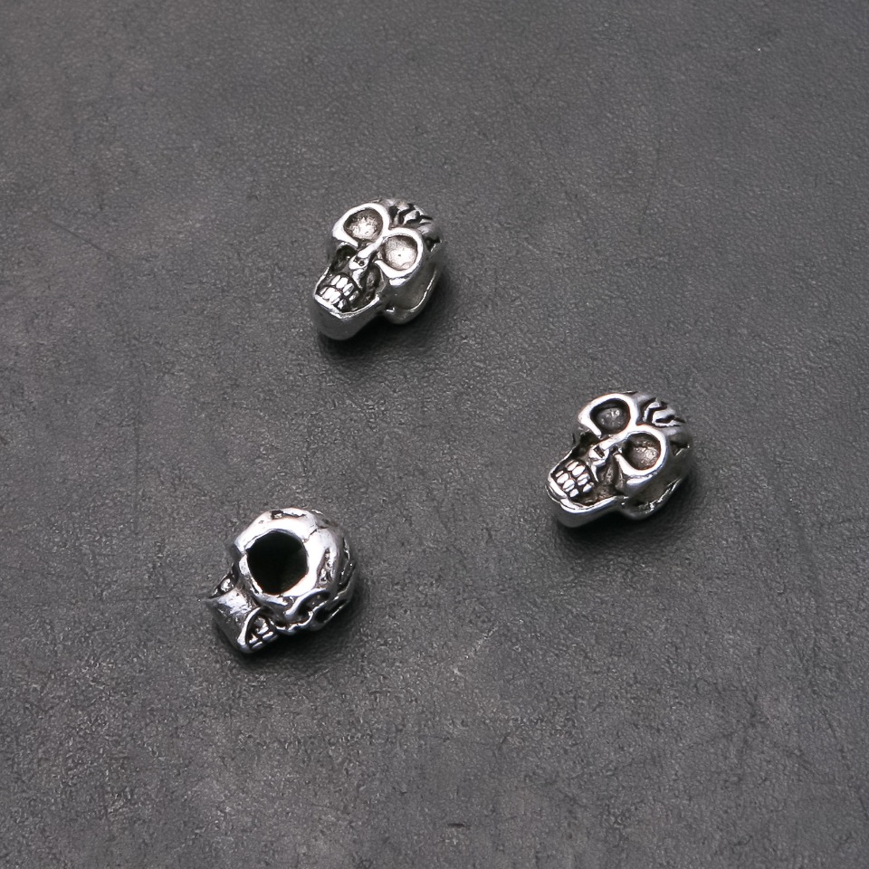 Kovové komponenty Pandora lebka, průměr 8 mm, vnitřní průměr 4,5 mm, délka 12 mm, balení 20 g, 9 ks (+ -)
