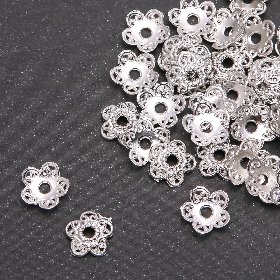 Koncovka pro bižuterii, průměr 12×3 mm, vnitřní otvor 2,4 mm, 4 mm faz., 20 g ± 53 ks