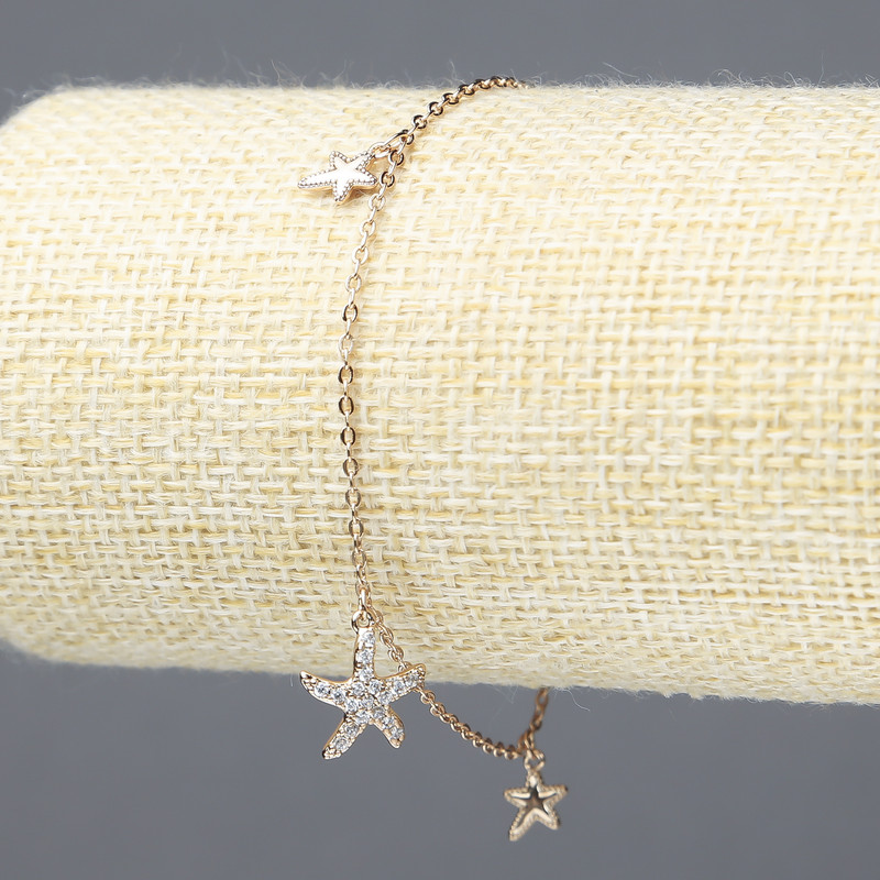 Náramek Xuping s pozlacením 18K a bílé štrasové kameny