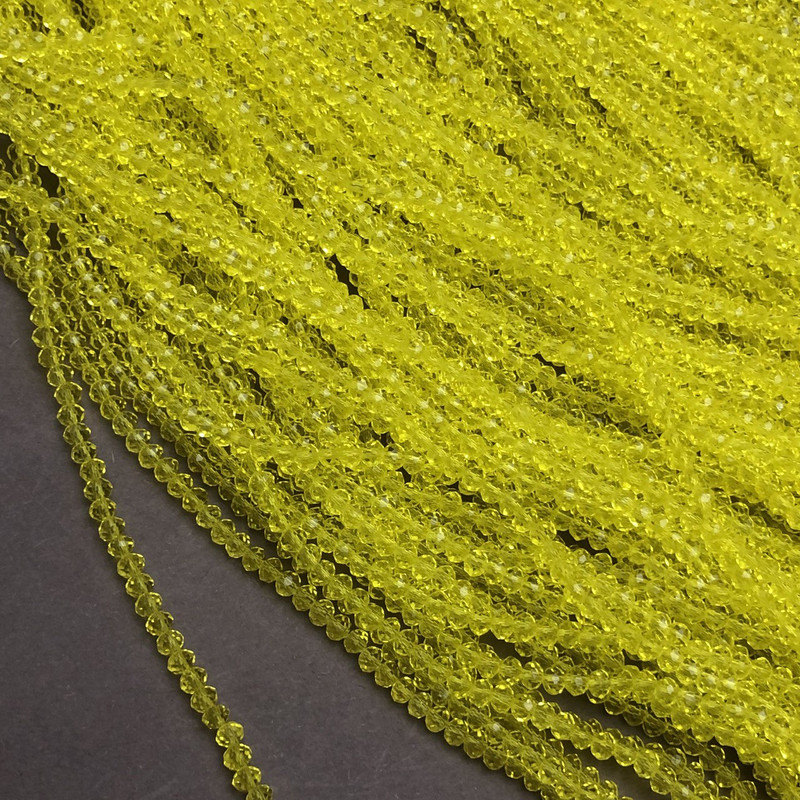 Žluté broušené korálky Český křišťál na niti, žlutě průhledné rondely, průměr 3×2,5 mm, délka 36–38 cm