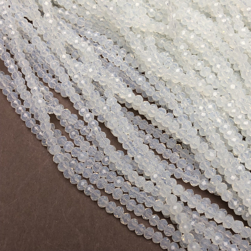 Korálky Českého křišťálu na vlascové niti, mléčně průhledné briliantně broušené rondelové korálky, průměr 3,5×3 mm, délka 36–38 cm