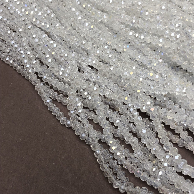 Korálky Český křišťál na vlascu bílé průhledné s benzínovým leskem, brusovaný rondel, průměr 3,5×3 mm, délka 36–38 cm +