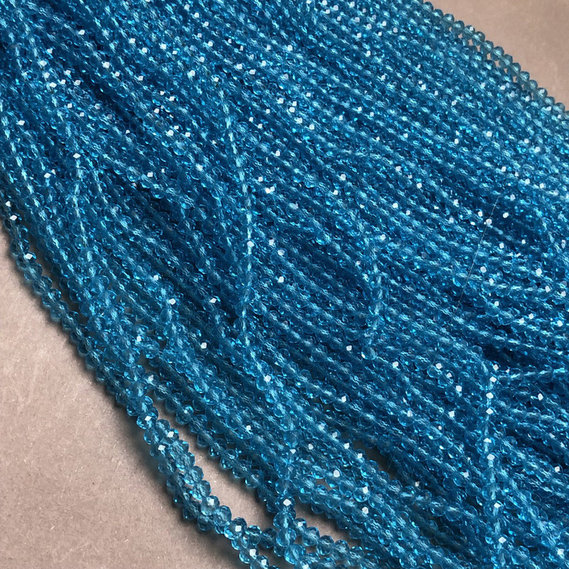 Korálky českého křišťálu na vlasové niti modro-zelené průhledné broušené rondely, průměr 3,5×3 mm + -, délka 36–38 cm +