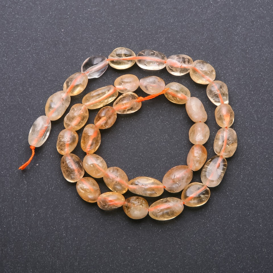 Citronové korálky na niti, ve tvaru galetových korálků, průměr 8×12 mm, délka 38 cm