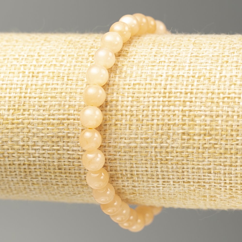 Náramek na gumičce z akrylového selenitu, hladká kulička, průměr 6,5 mm, délka 18 cm