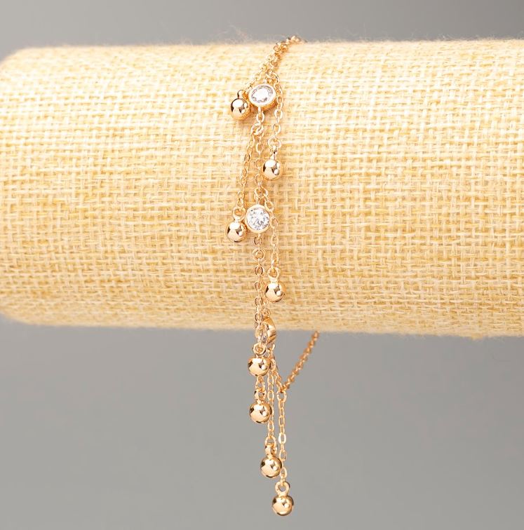 Náramek Xuping s pozlacením 18K, délka 18–20 cm, tloušťka cca 1,5 mm, s kuličkami o průměru 4 mm, s bílými štrasami