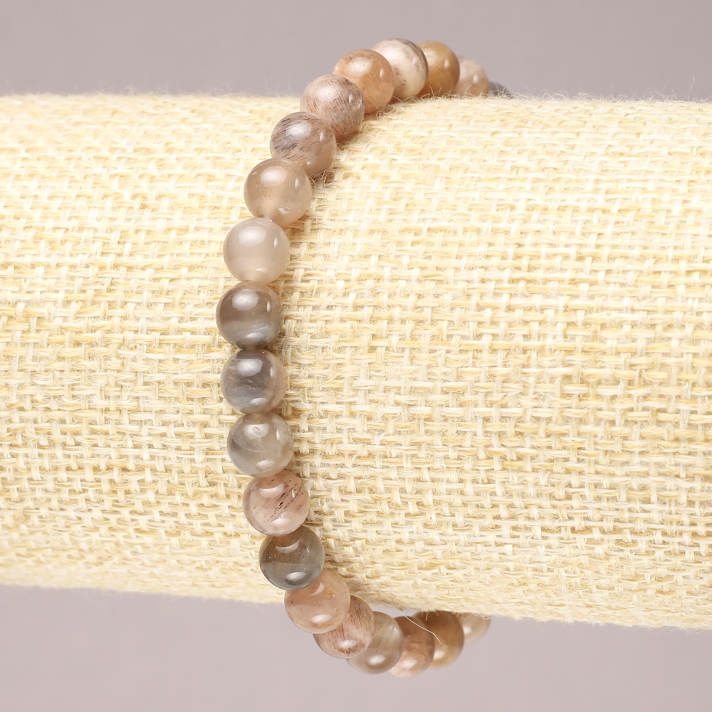 Náramek na gumičce z přírodního selenitu, hladká kulička, průměr 6 mm+